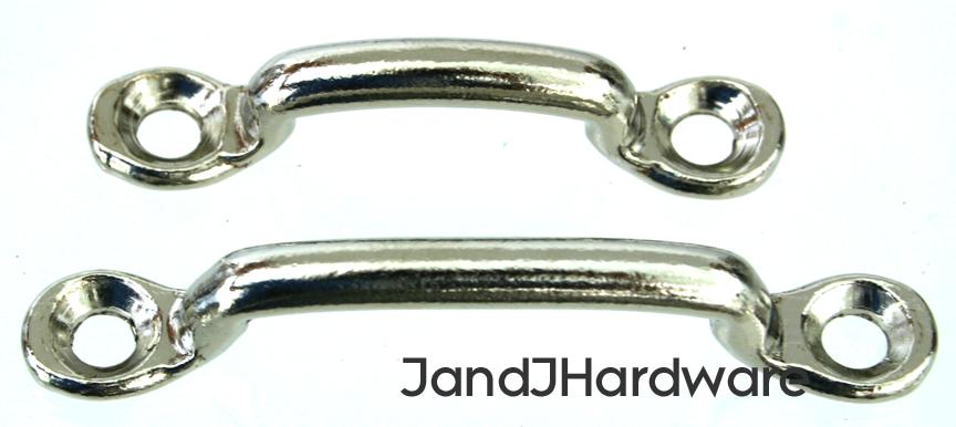 An image of a footman's loop, a cast metal device screwed to something and used to act as a guide for a strap